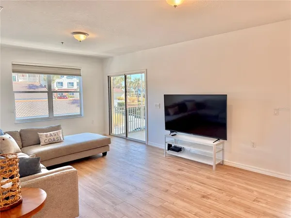 a view of a balcony with wooden floor