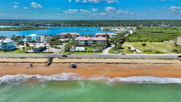 an aerial view of a house with a lake view