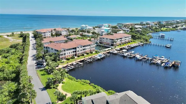 an aerial view of a houses with a lake view