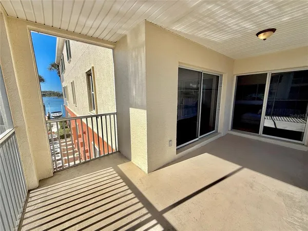 a view of a balcony with wooden floor