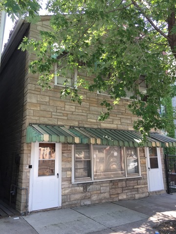 1232 North Noble Street Chicago, IL 60642 - Photo 1 of 7 a front view of a house with a tree