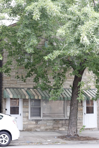 1232 North Noble Street Chicago, IL 60642 - Photo 3 of 7 a front view of a house with a yard