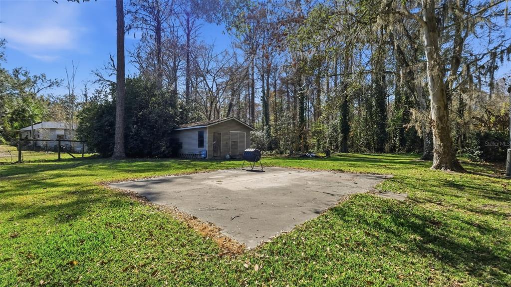 10565 Bessemer Street New Port Richey, FL 34654 - Photo 46 of 72 a view of a house with a yard