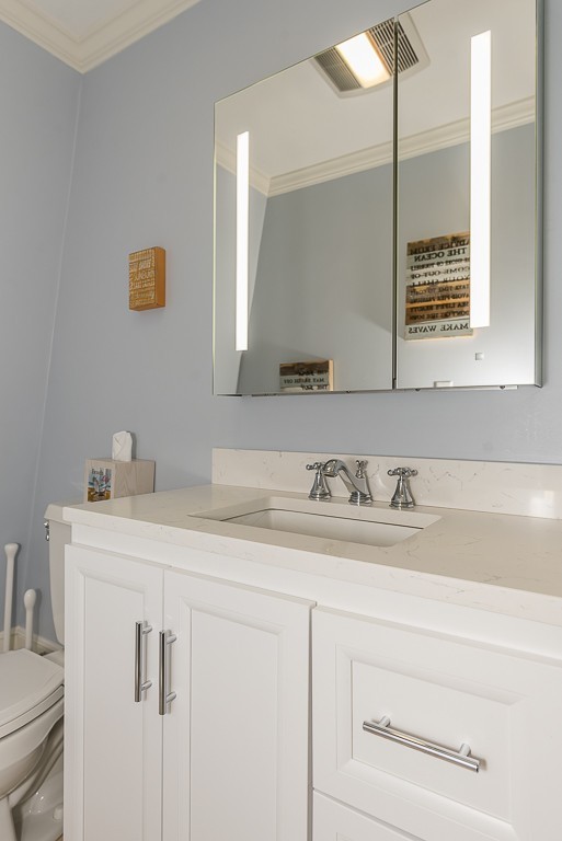 17 Vassar Road Marblehead, MA 01945 - Photo 29 of 30 a bathroom with a sink and a mirror