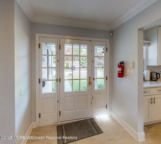 a view of a livingroom with wooden floor and windows