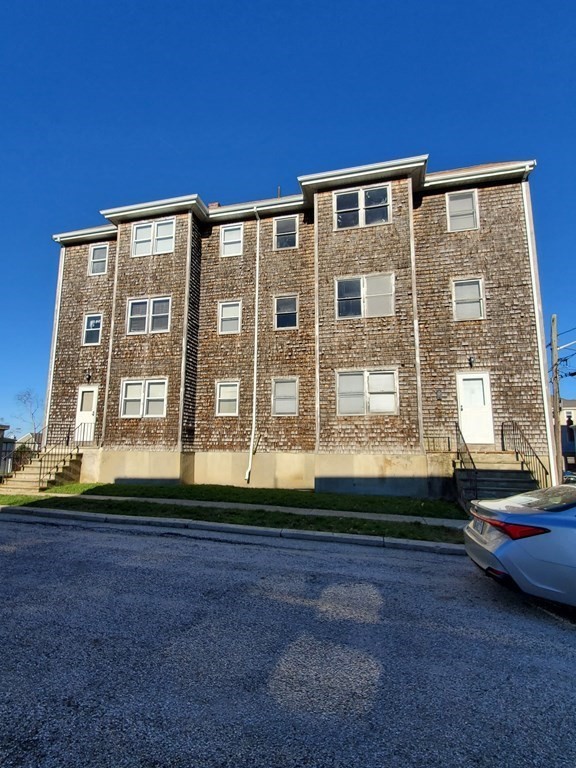 39 Beacon Street Fall River, MA 02721 - Photo 1 of 36 a front view of a house with a yard