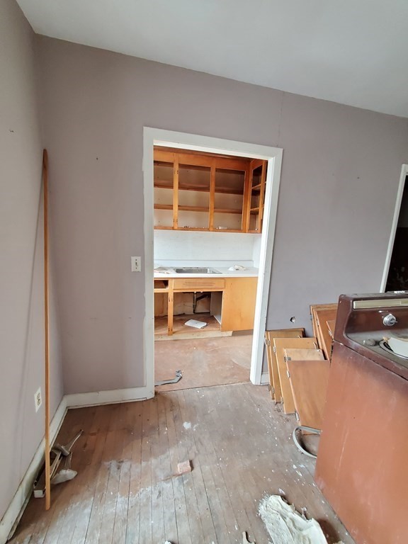 39 Beacon Street Fall River, MA 02721 - Photo 35 of 36 wooden floor and window in a room