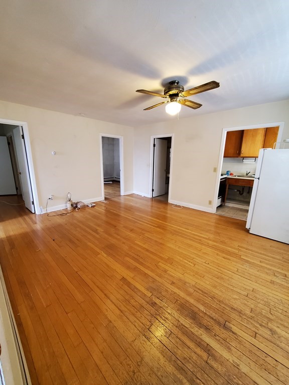 39 Beacon Street Fall River, MA 02721 - Photo 4 of 36 a view of a livingroom with a flat screen tv
