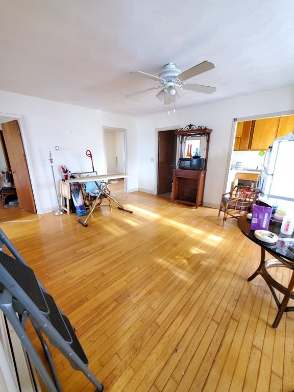 39 Beacon Street Fall River, MA 02721 - Photo 8 of 36 a room with a bed furniture and a flat screen tv