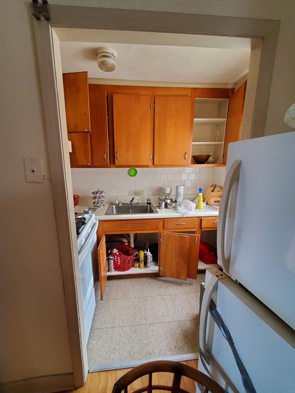 39 Beacon Street Fall River, MA 02721 - Photo 9 of 36 a room with storage and utility