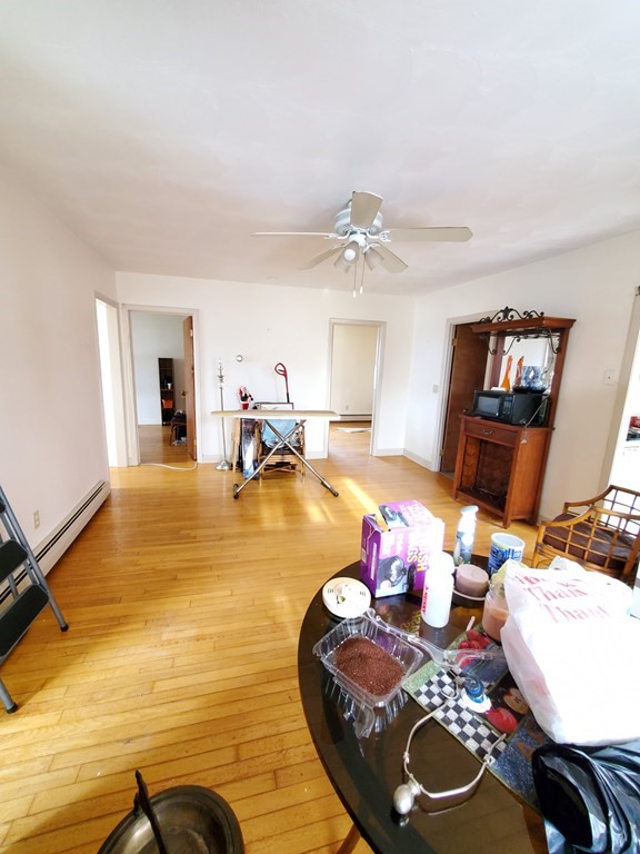 39 Beacon Street Fall River, MA 02721 - Photo 10 of 36 a living room with furniture and wooden floor