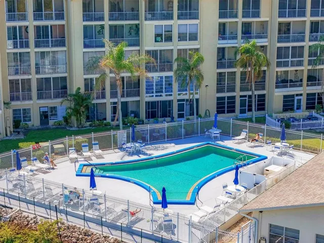 an aerial view of a house with a swimming pool