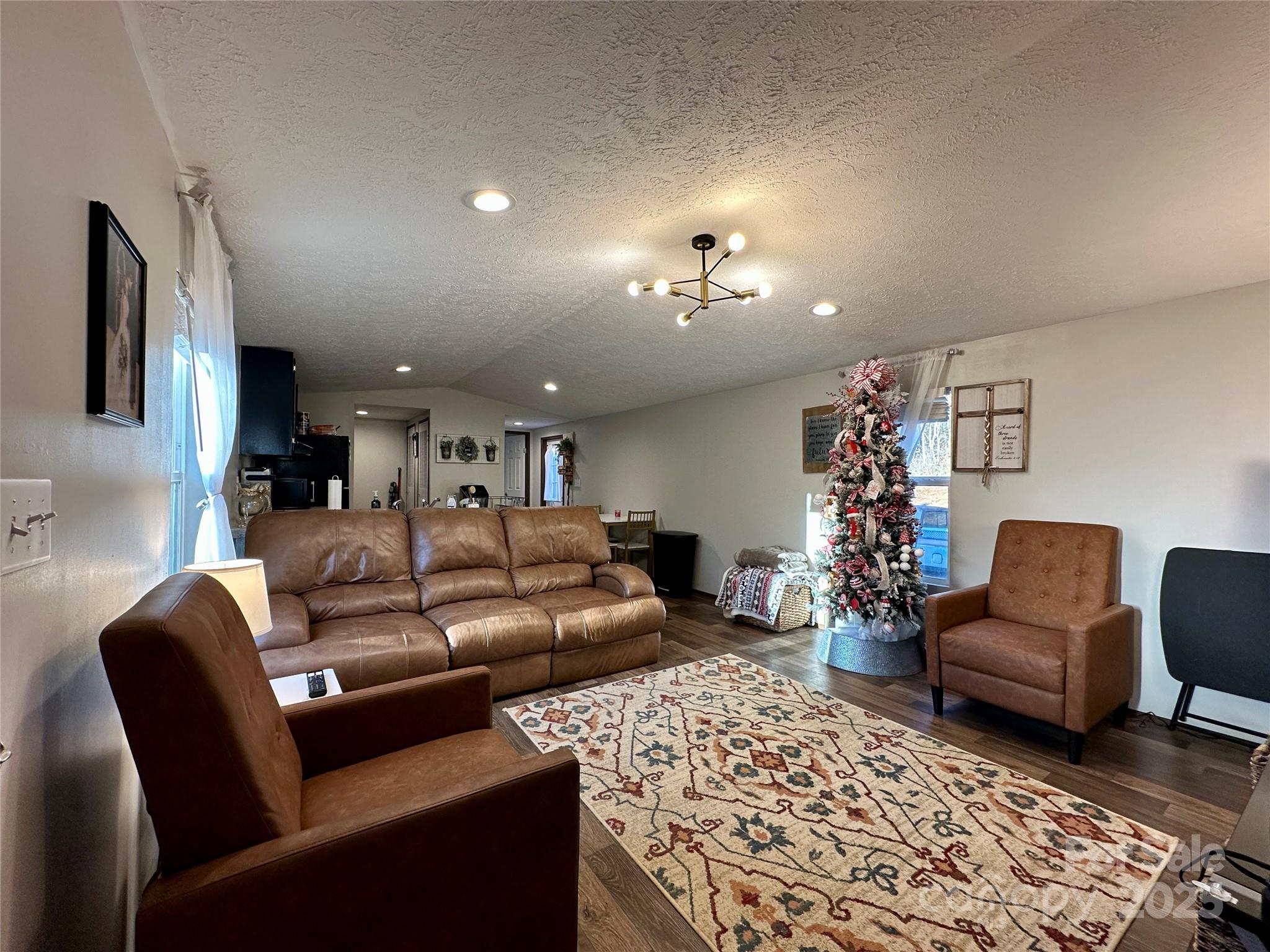 6264 Jenkins Road Morganton, NC 28655 - Photo 15 of 32 a living room with furniture and a rug