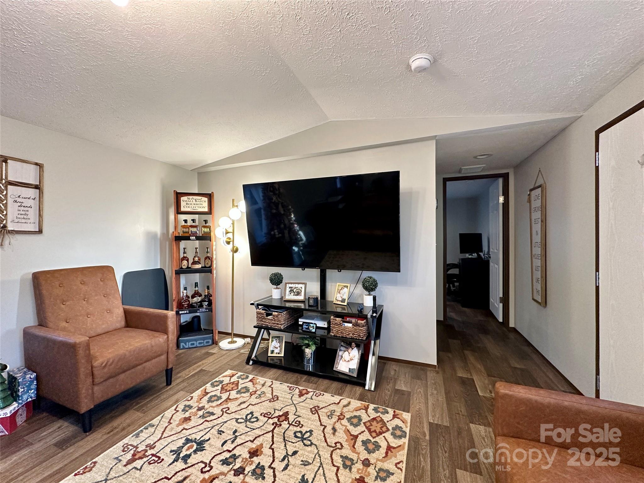 6264 Jenkins Road Morganton, NC 28655 - Photo 16 of 32 a living room with furniture and a flat screen tv