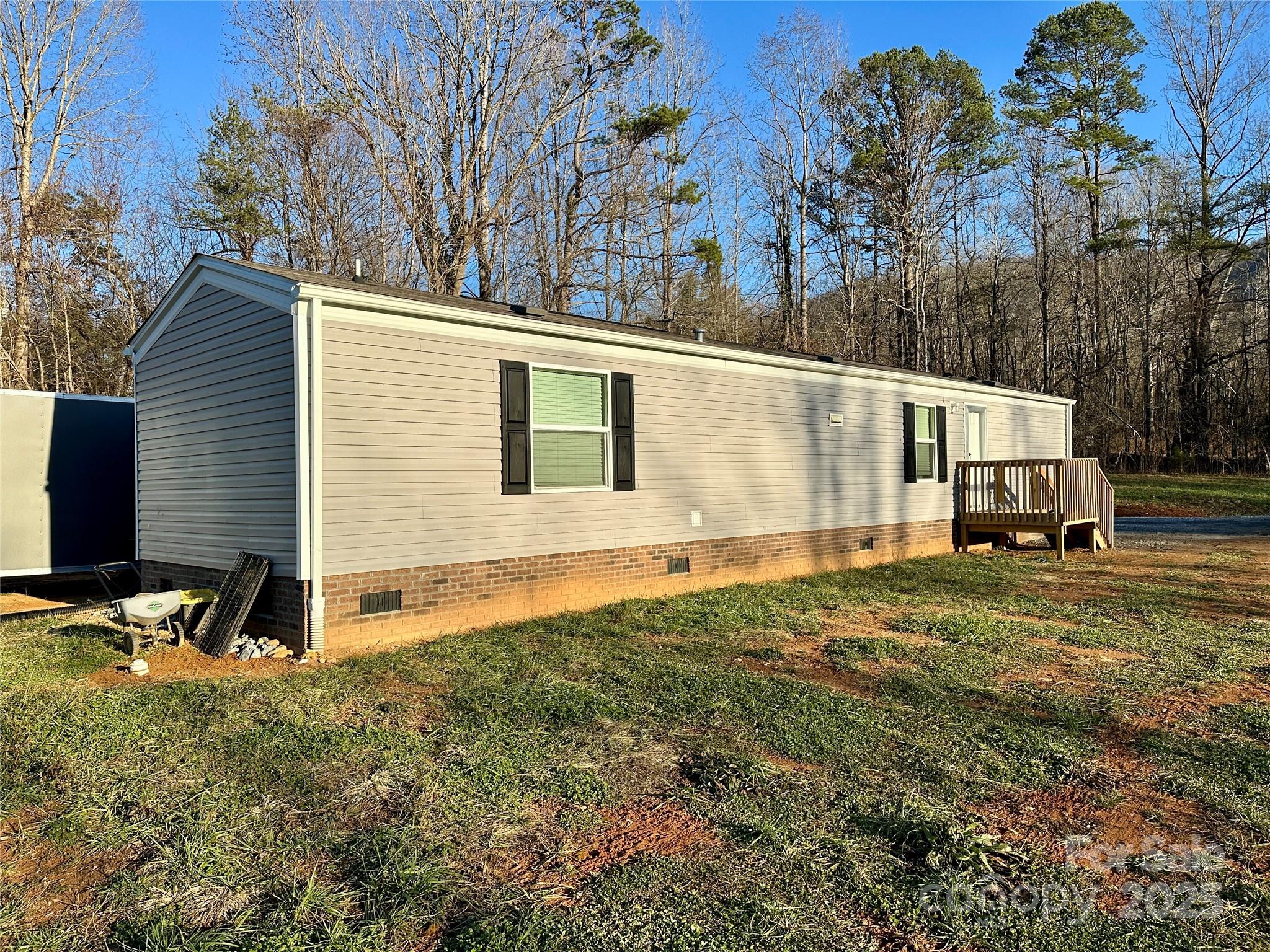 6264 Jenkins Road Morganton, NC 28655 - Photo 2 of 32 a view of a house with backyard and trees