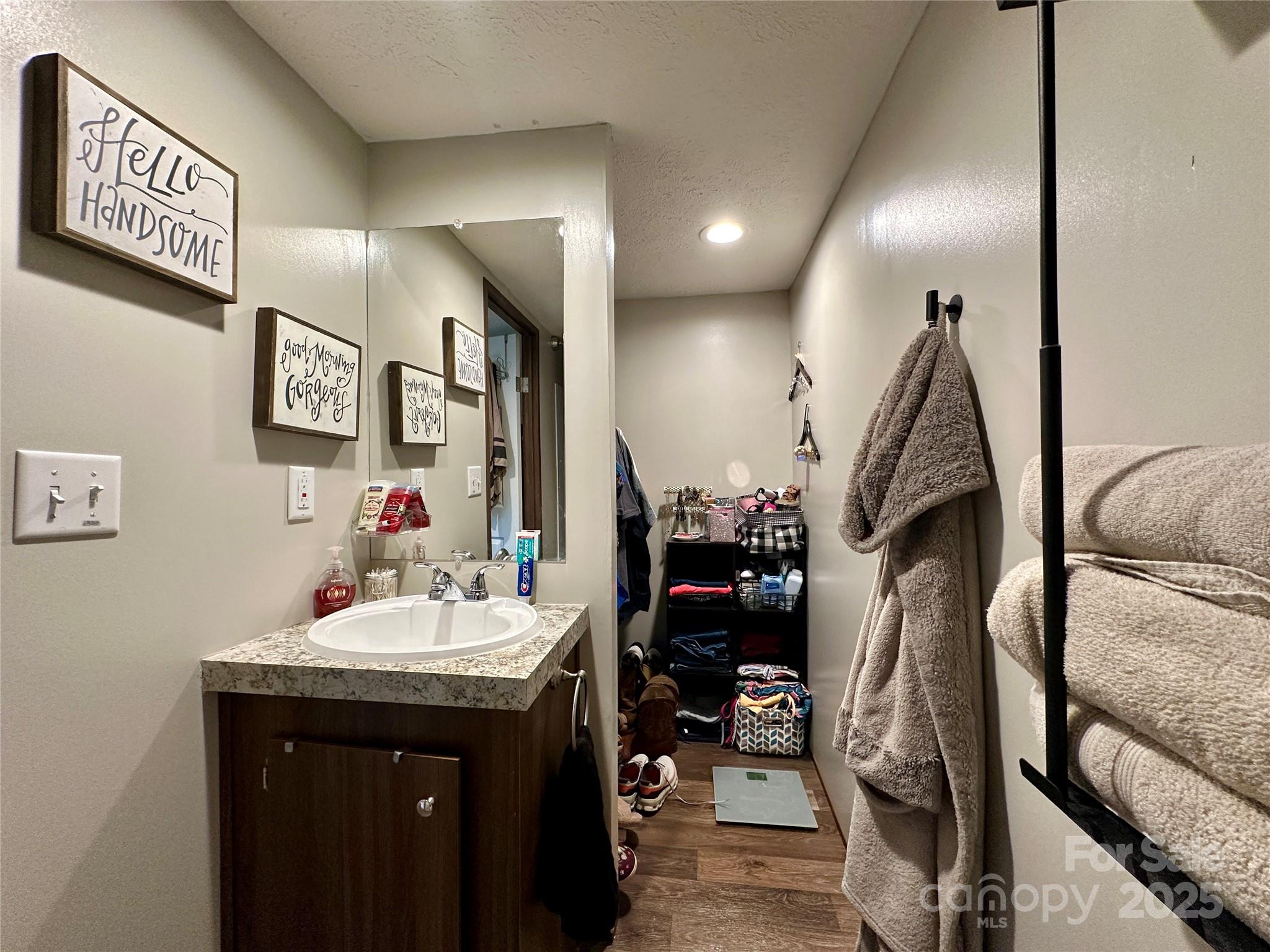 6264 Jenkins Road Morganton, NC 28655 - Photo 23 of 32 a bathroom with double vanity and a mirror