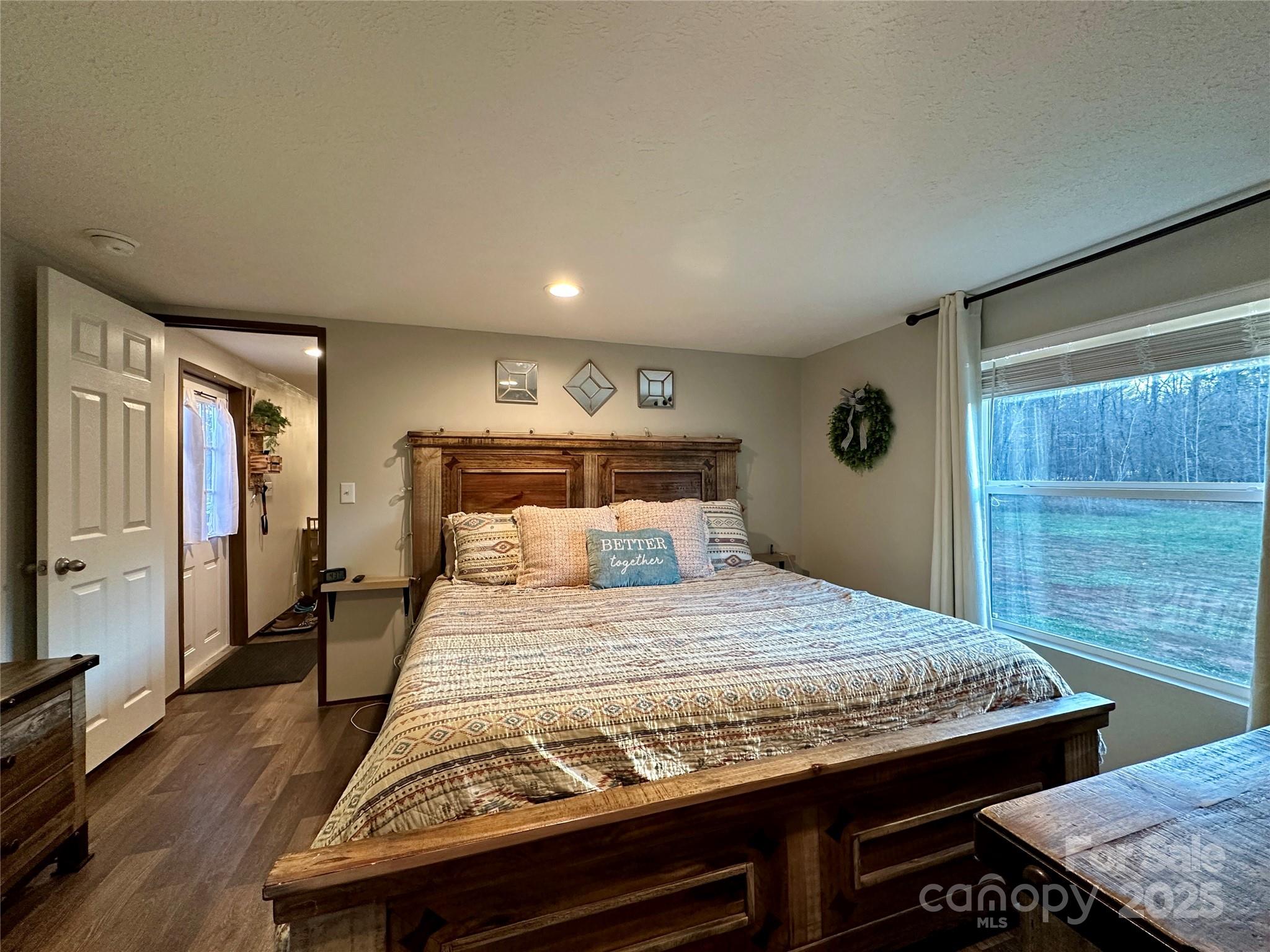 6264 Jenkins Road Morganton, NC 28655 - Photo 25 of 32 a bedroom with a bed and a dresser
