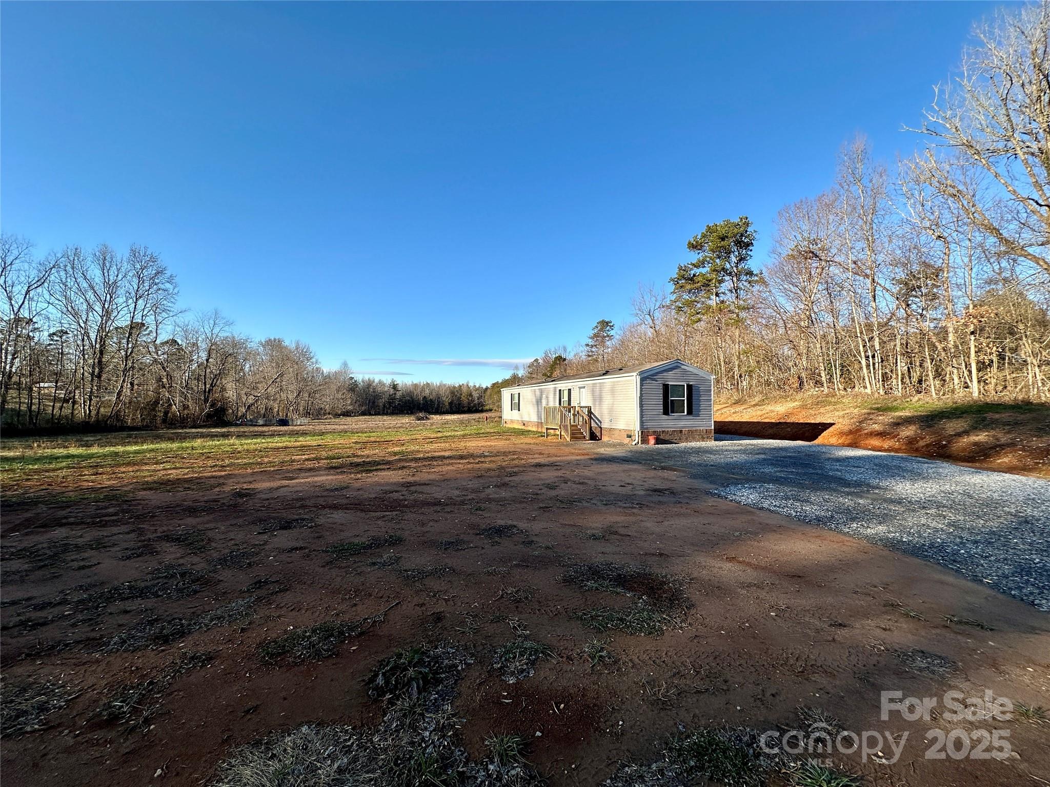 6264 Jenkins Road Morganton, NC 28655 - Photo 4 of 32 a view of a house with a yard