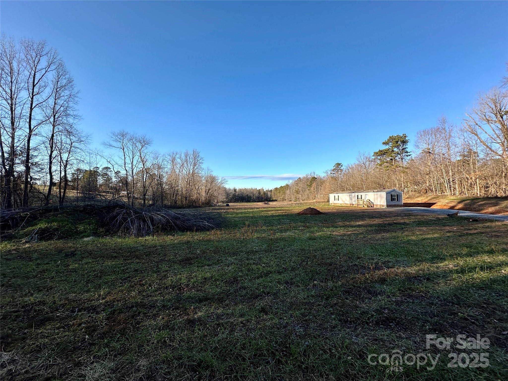 6264 Jenkins Road Morganton, NC 28655 - Photo 5 of 32 a view of a grassy area with an trees