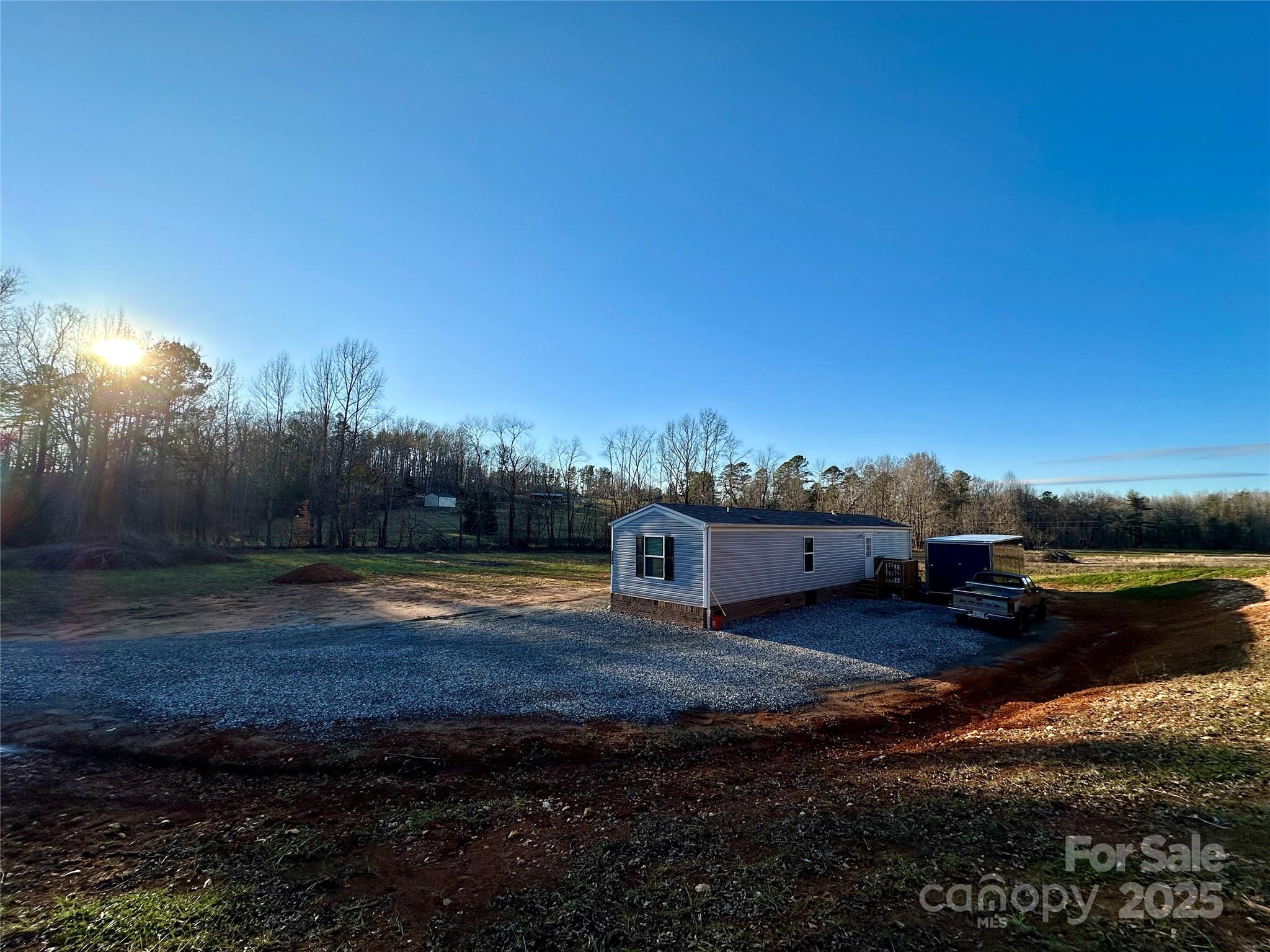 6264 Jenkins Road Morganton, NC 28655 - Photo 6 of 32 a view of a lake with lawn chairs