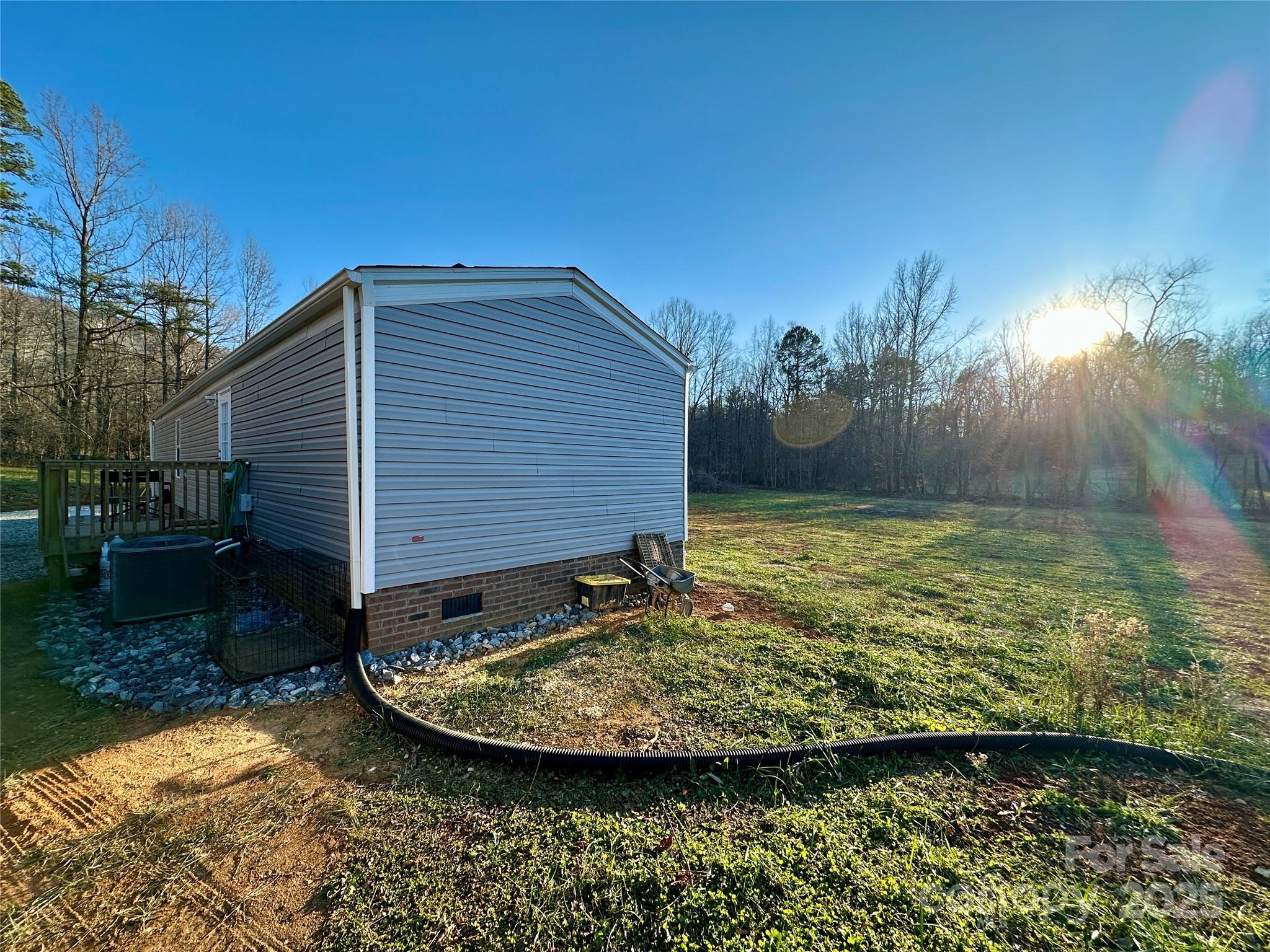 6264 Jenkins Road Morganton, NC 28655 - Photo 10 of 32 a view of a backyard with plants and lake