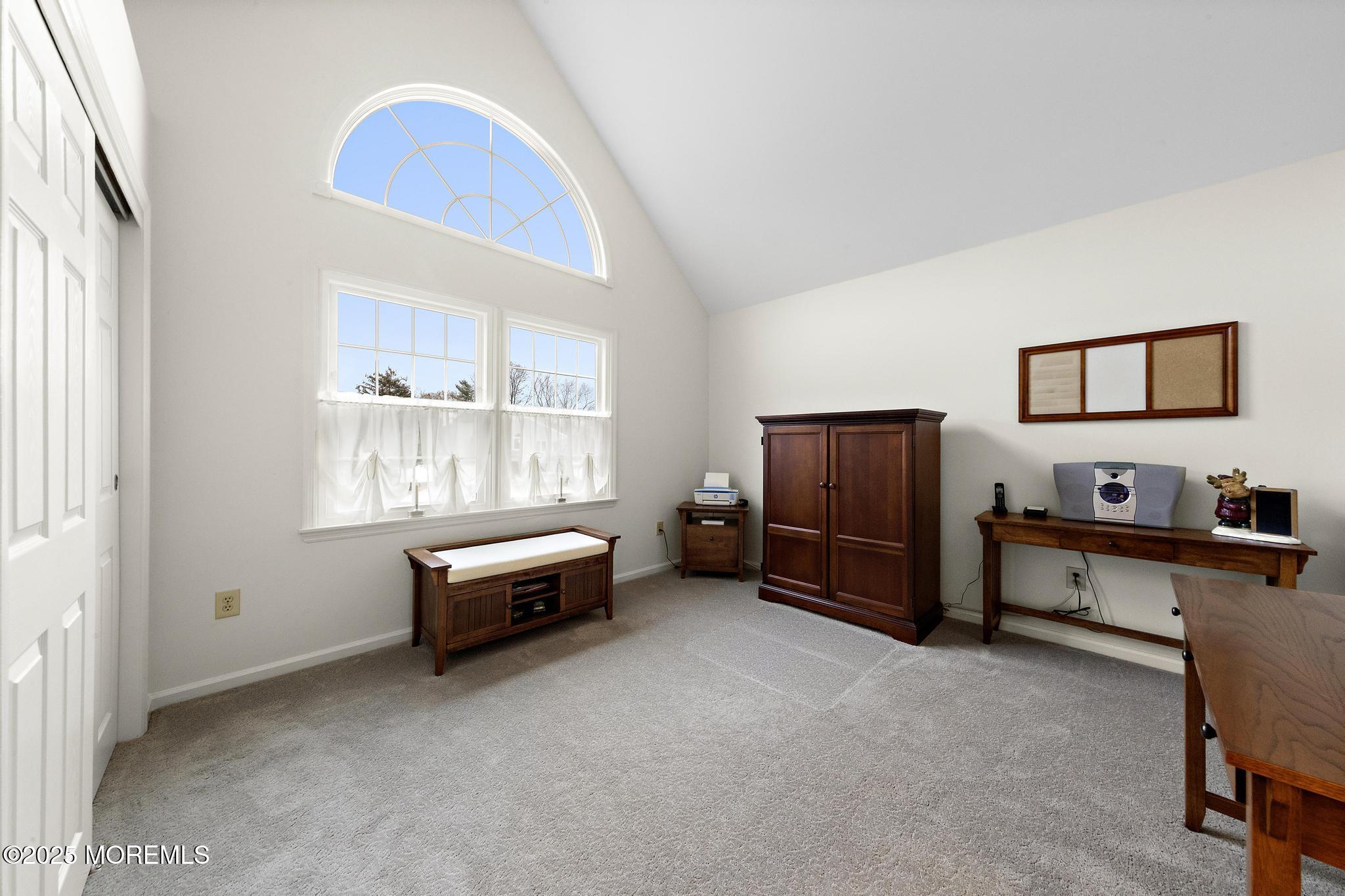 69 Chestnut Court Brick, NJ 08723 - Photo 17 of 23 a spacious bedroom with a bed and a window