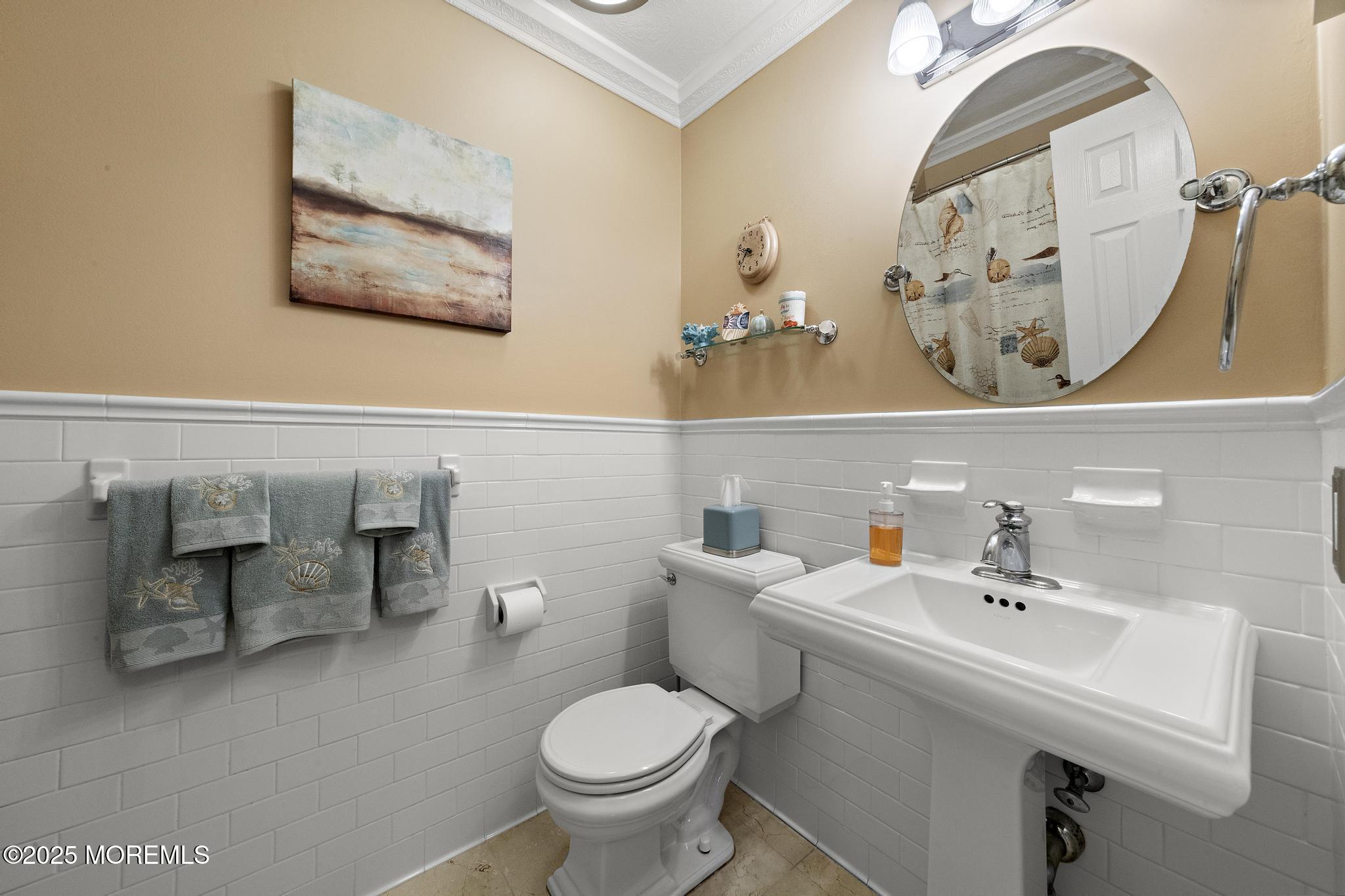 69 Chestnut Court Brick, NJ 08723 - Photo 18 of 23 a bathroom with a sink mirror and toilet