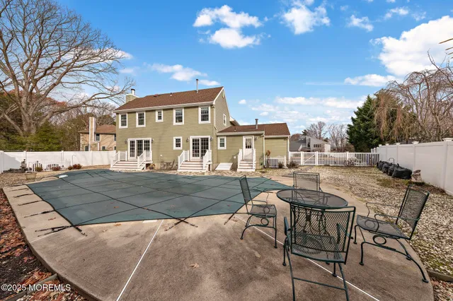 a view of a swimming pool with a lounge chairs