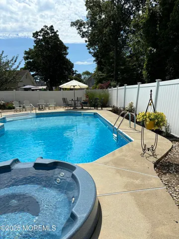 a view of a house with a yard and garage