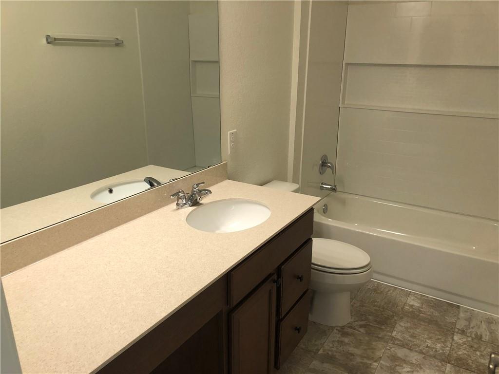 625 Jud Allen Way Leander, TX 78641 - Photo 15 of 18 Full bathroom featuring vanity and shower / tub combination