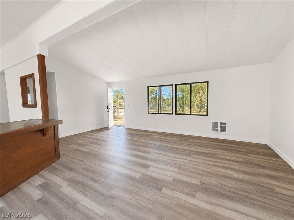 1611 West Blosser Ranch Road Pahrump, NV 89060 - Photo 5 of 25 A versatile great room offers ample space, complete with durable flooring and natural light.