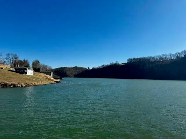 a view of a lake and sunset