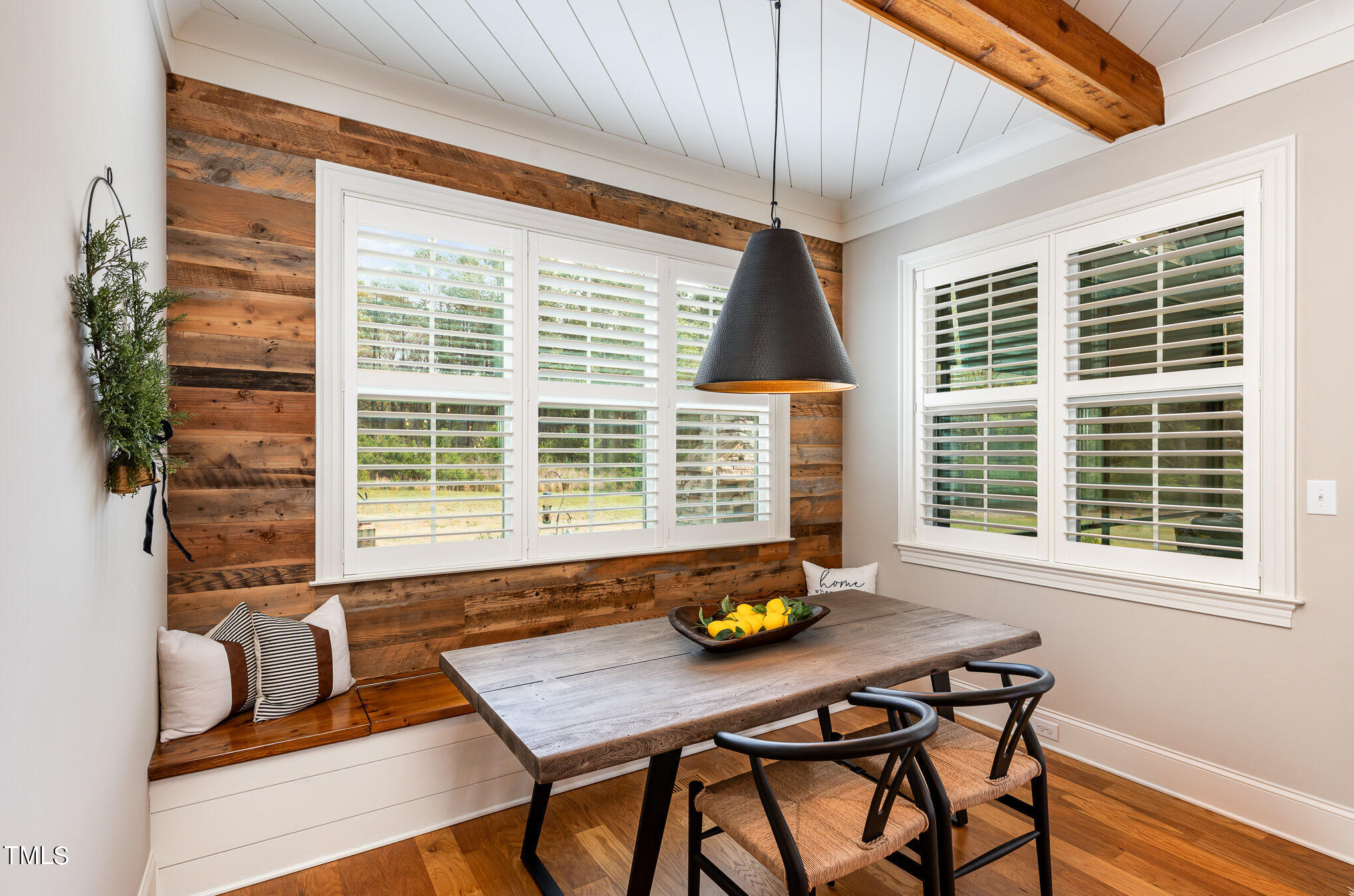 1505 Sweetwater Lane Raleigh, NC 27610 - Photo 12 of 54 Breakfast Room w/Built In Bench for Seating for a Crowd. Barnwood Accent Wall, and Views of the Gardens and Outdoor Living Space