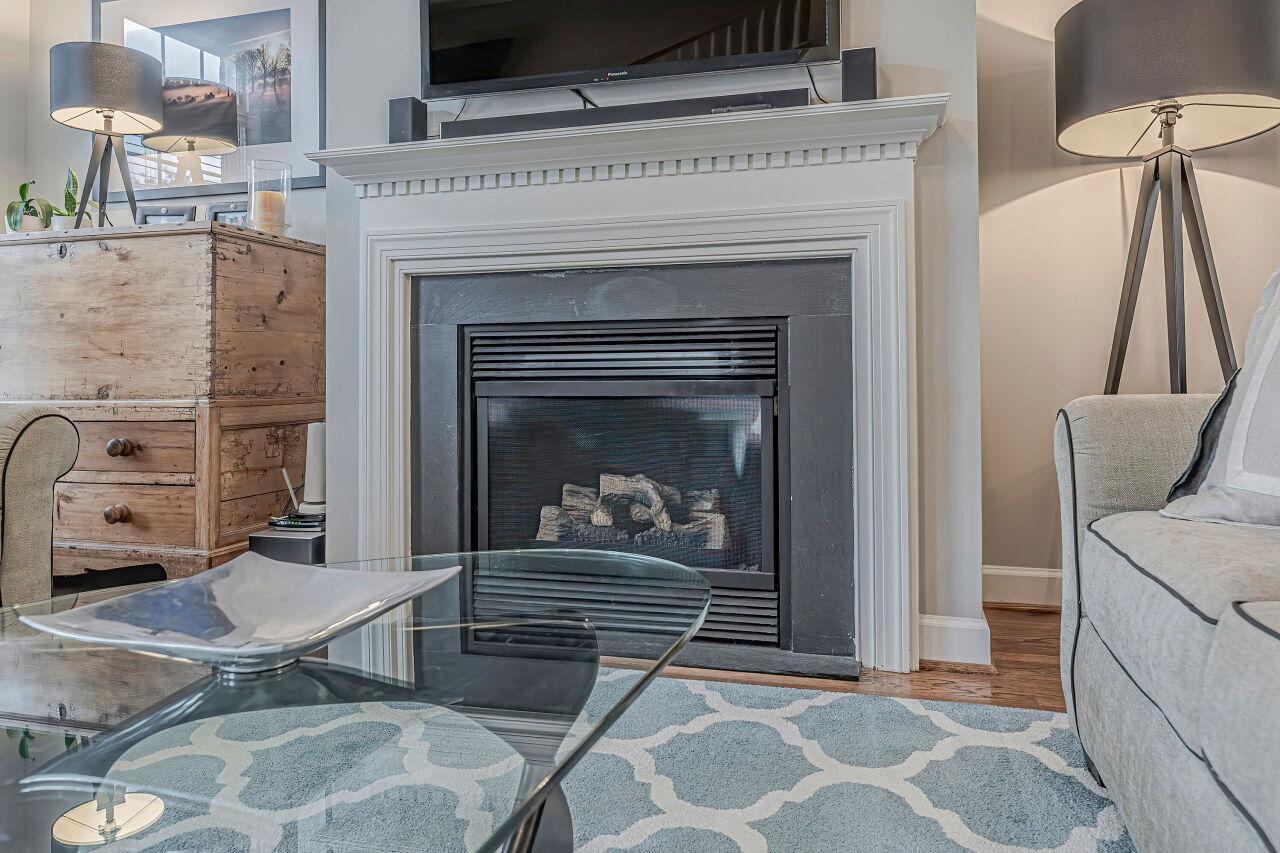 106 Hatfield Lane Raleigh, NC 27603 - Photo 6 of 29 a living room with furniture and a fireplace