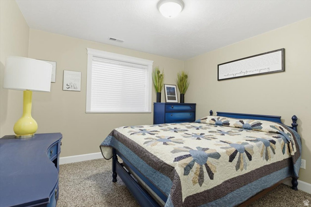 772 East 600 South Preston, ID 83263 - Photo 25 of 35 Recessed window with white blinds, neutral wall paint, and light-colored carpeting
