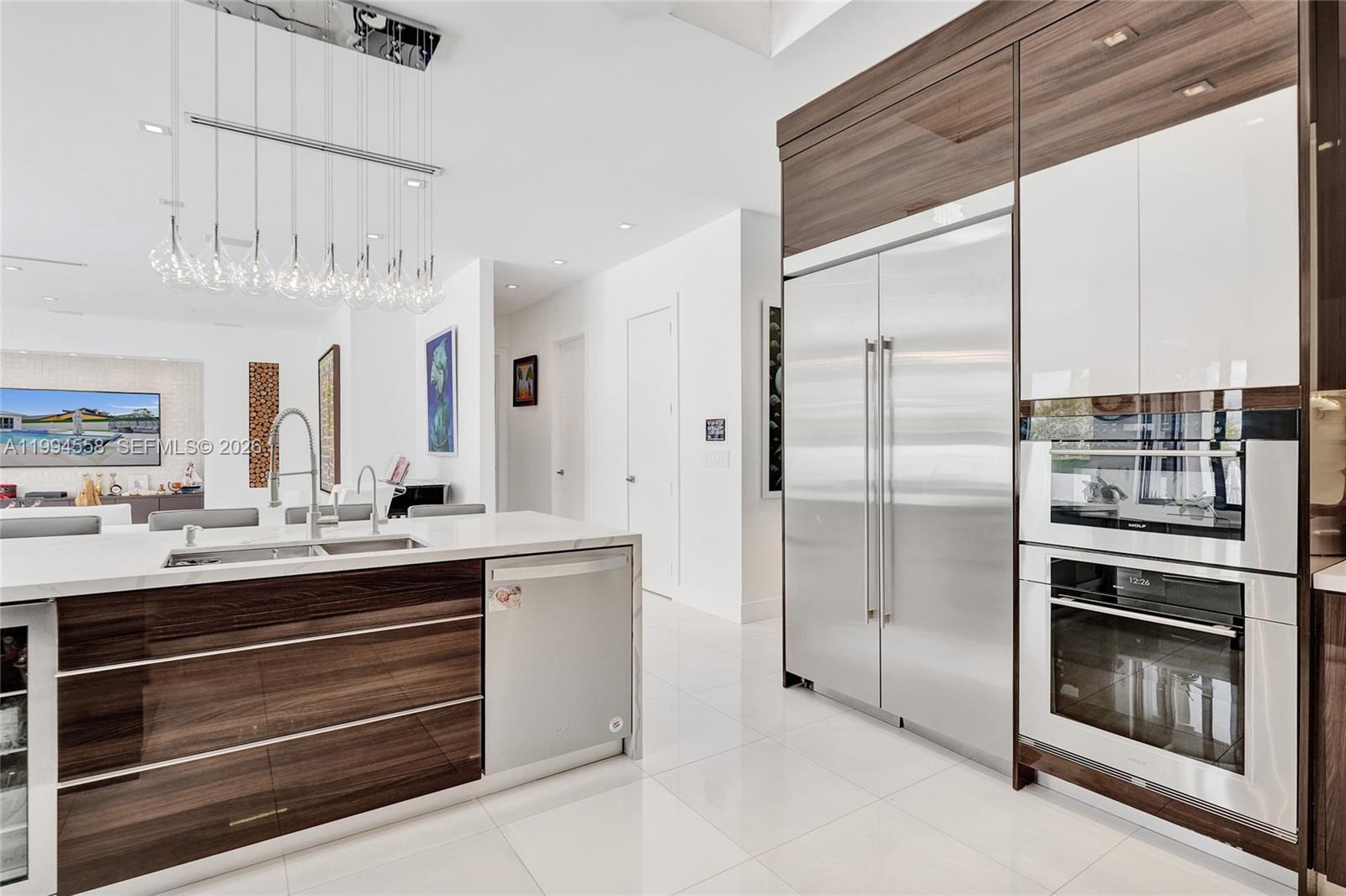 2600 Southwest 128th Court Miami, FL 33175 - Photo 16 of 50 a kitchen with stainless steel appliances a stove and a refrigerator