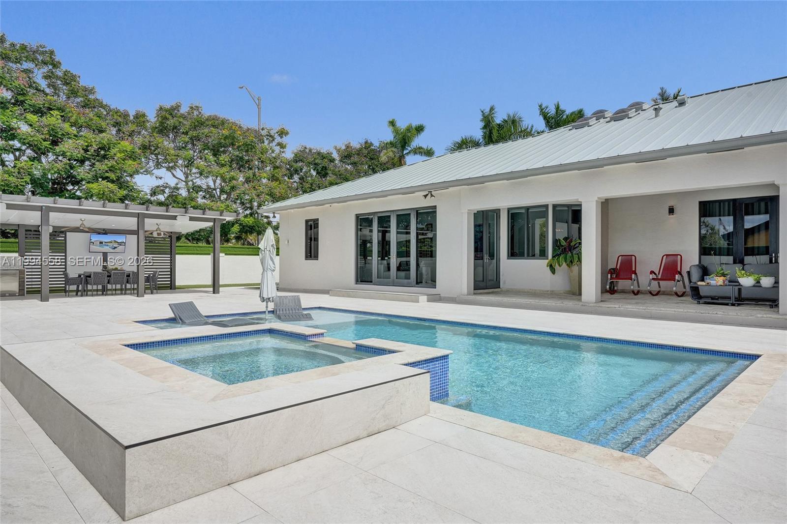 2600 Southwest 128th Court Miami, FL 33175 - Photo 20 of 50 a view of a house with swimming pool and sitting area
