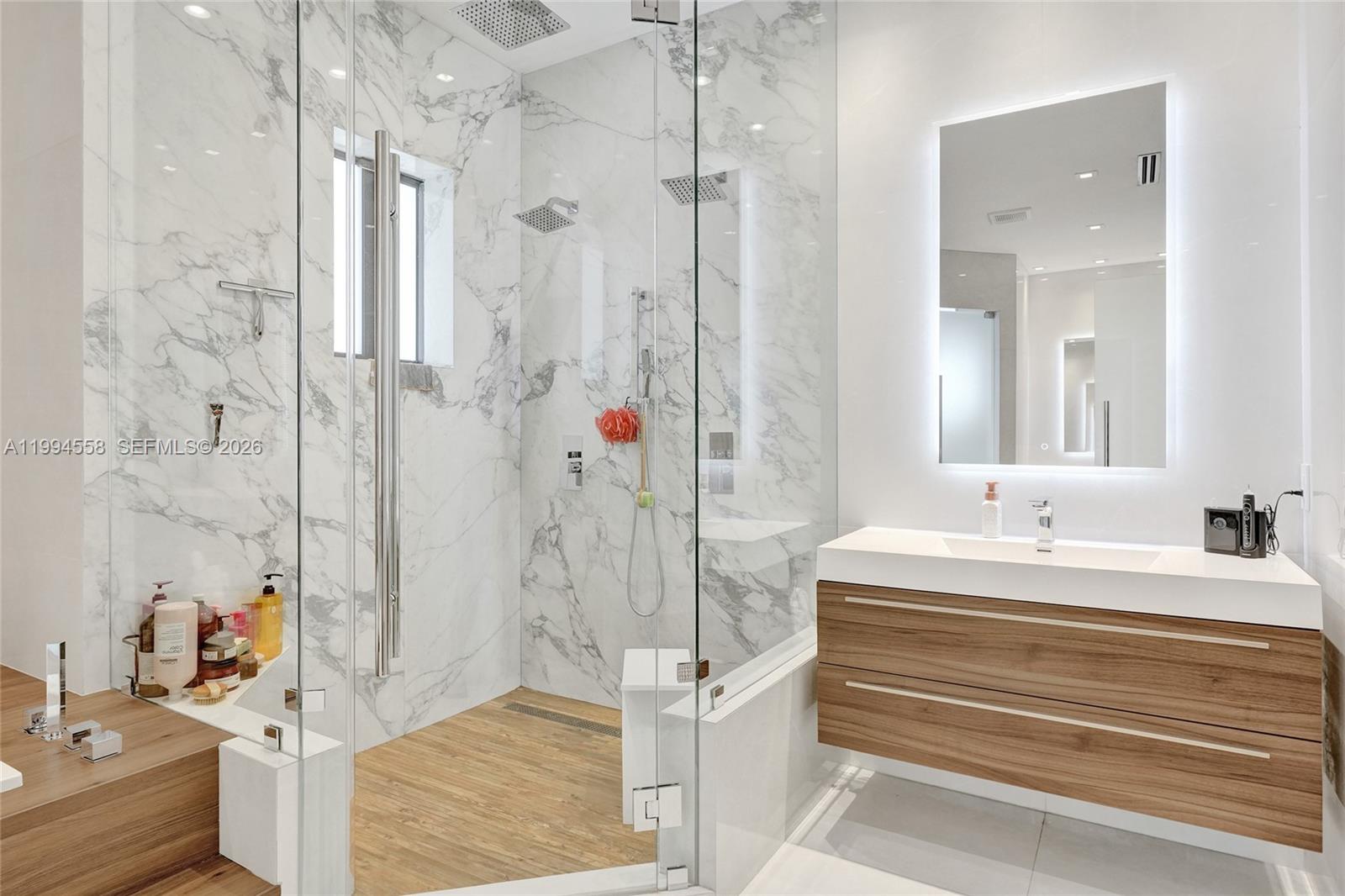 2600 Southwest 128th Court Miami, FL 33175 - Photo 35 of 50 a bathroom with a tub sink and mirror