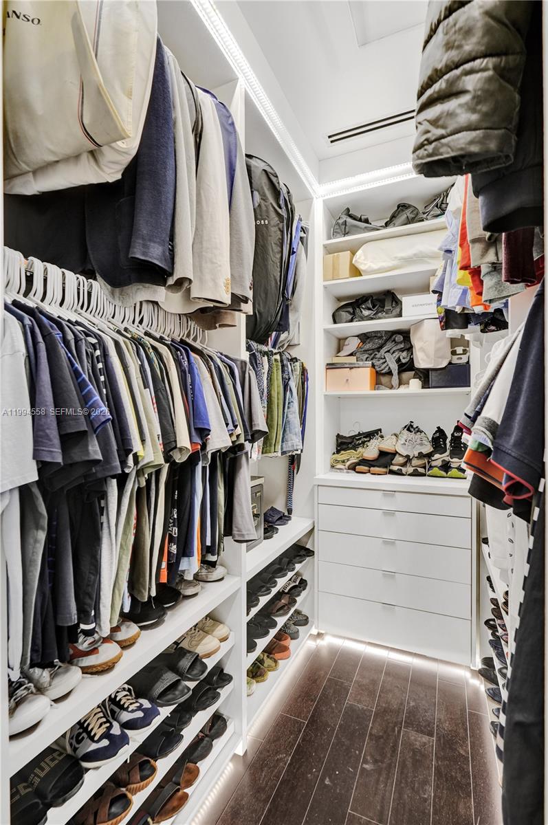 2600 Southwest 128th Court Miami, FL 33175 - Photo 37 of 50 a view of walk in closet with clothes and shoes
