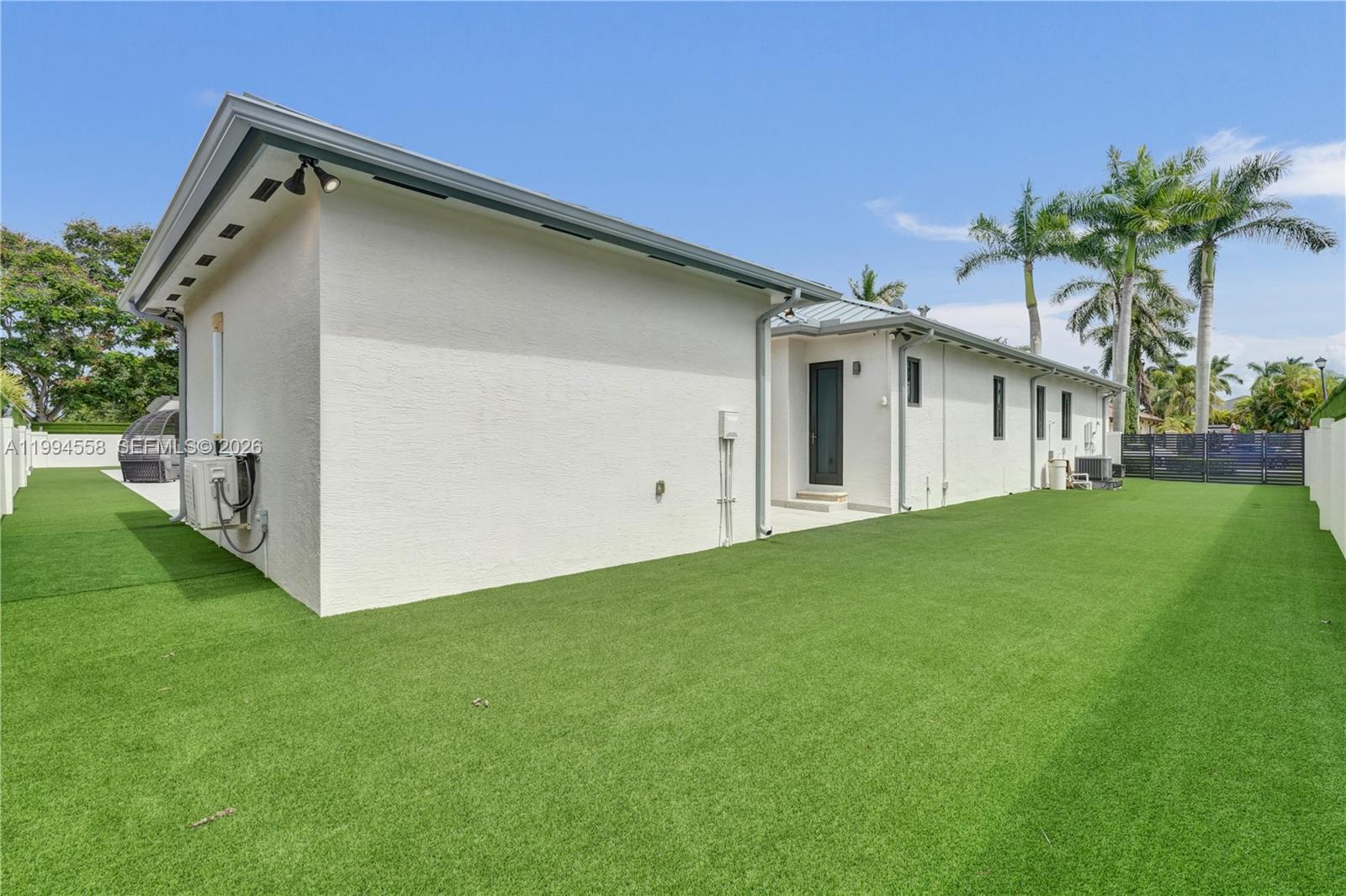 2600 Southwest 128th Court Miami, FL 33175 - Photo 49 of 50 a view of a house with a yard