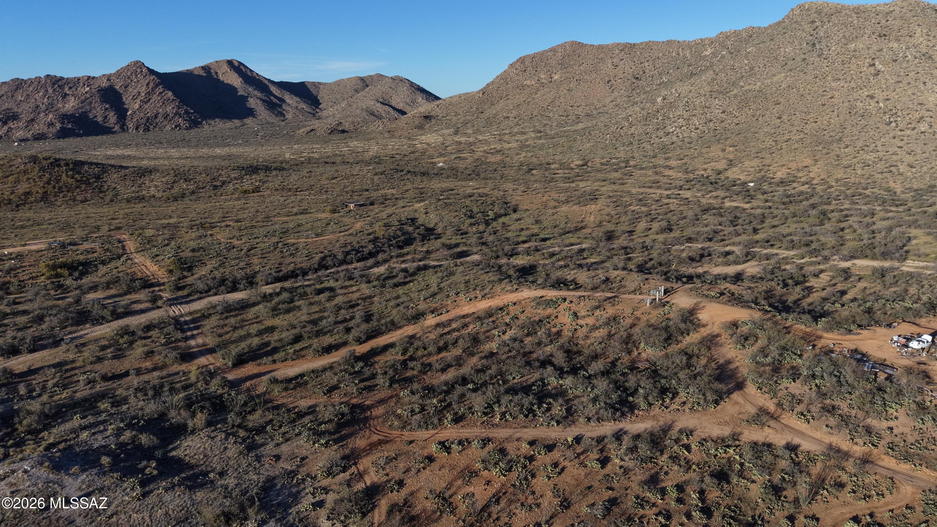 17027 South Sierrita Mountain Road Tucson, AZ 85736 - Photo 29 of 34 a view of a dry yard with mountains in the background
