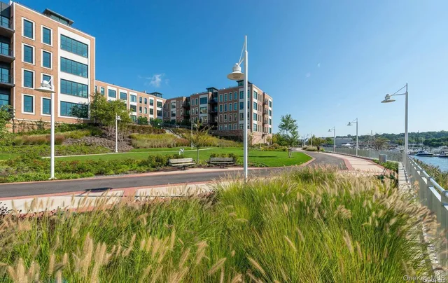 a view of a garden with a building in the background