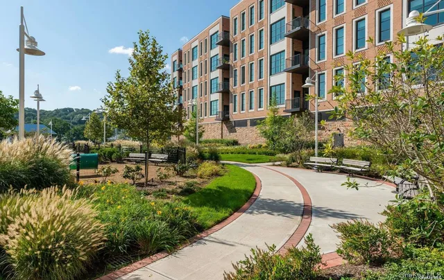 a view of a building with garden and pathway
