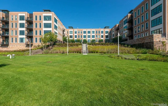 a view of a building with a yard