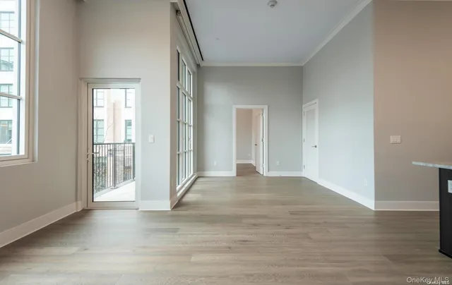 a view of entryway with wooden floor