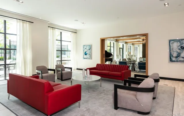 a living room with furniture and windows