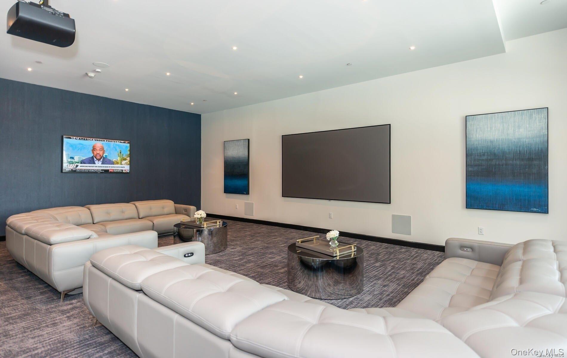 100 Garvies Point Road, Unit 1014 Glen Cove, NY 11542 - Photo 23 of 27 a living room with furniture and a flat screen tv