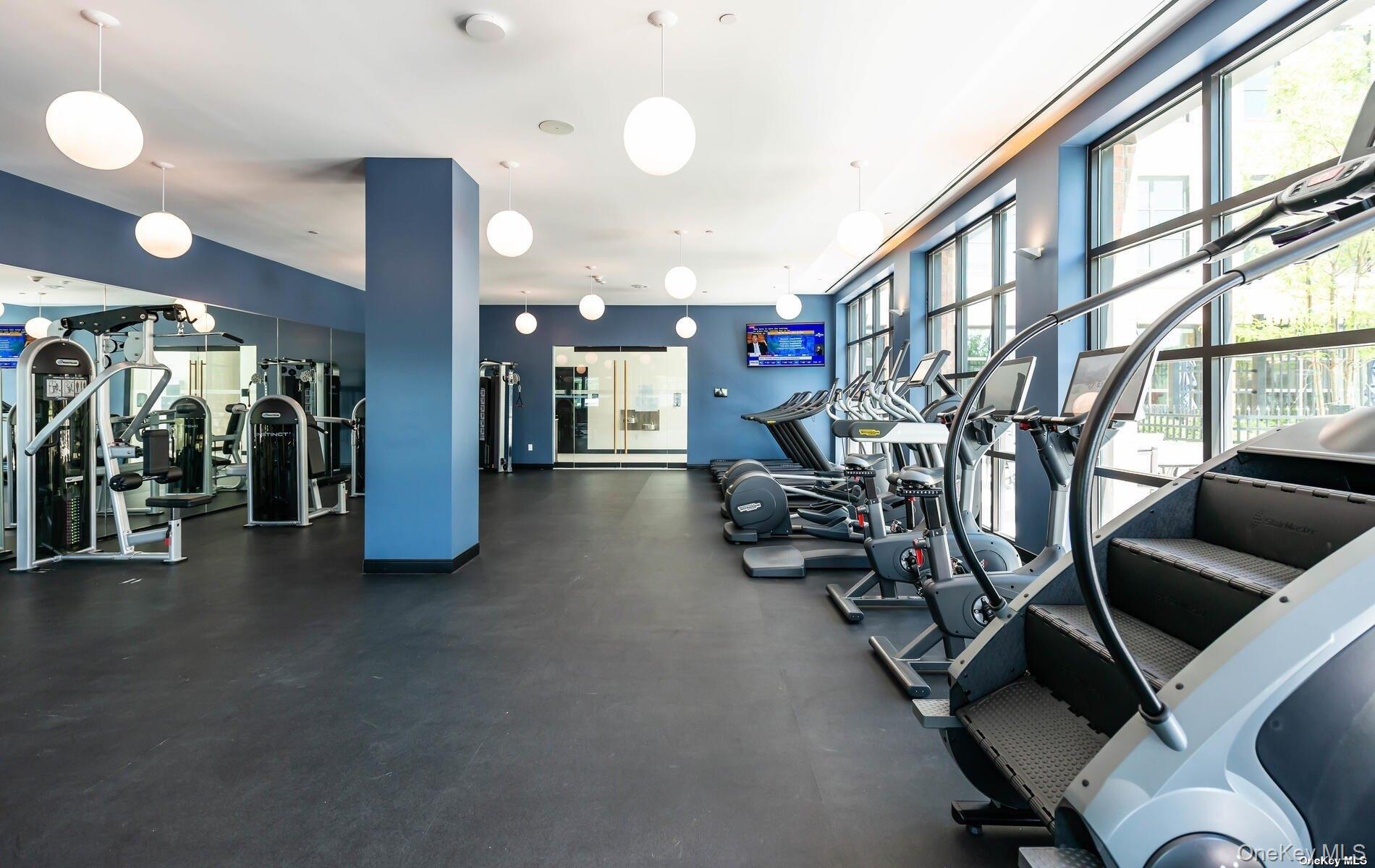 100 Garvies Point Road, Unit 1014 Glen Cove, NY 11542 - Photo 26 of 27 a view of a room with gym equipment