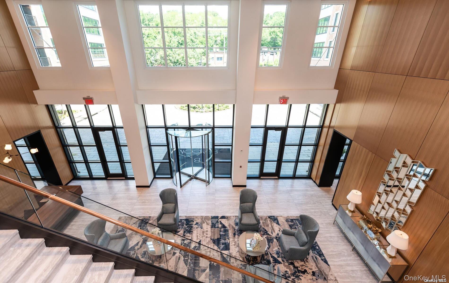 100 Garvies Point Road, Unit 1014 Glen Cove, NY 11542 - Photo 27 of 27 a living room with furniture and a large window