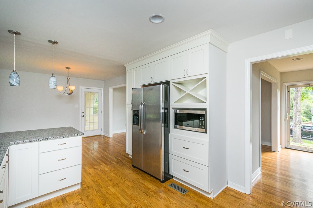 3703 Cheyenne Road Richmond, VA 23235 - Photo 5 of 21 a view of a kitchen cabinets and wooden floor